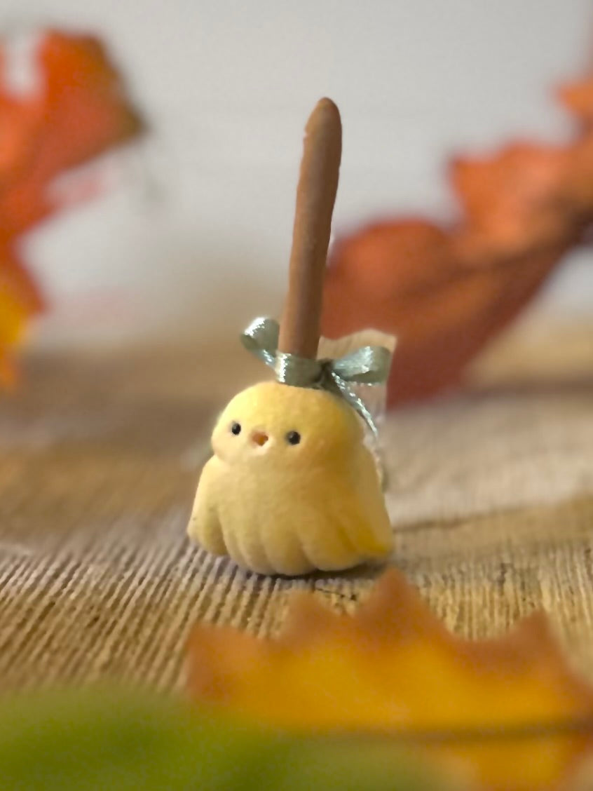 Broomhilda 2 inch flocked, clay figurine with wooden base.