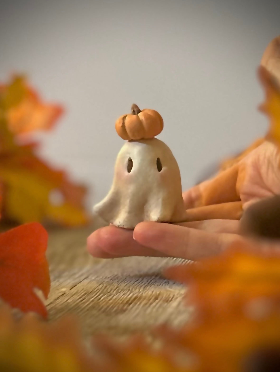 Punkin head Boo 2 inch clay figurine with wooden base.