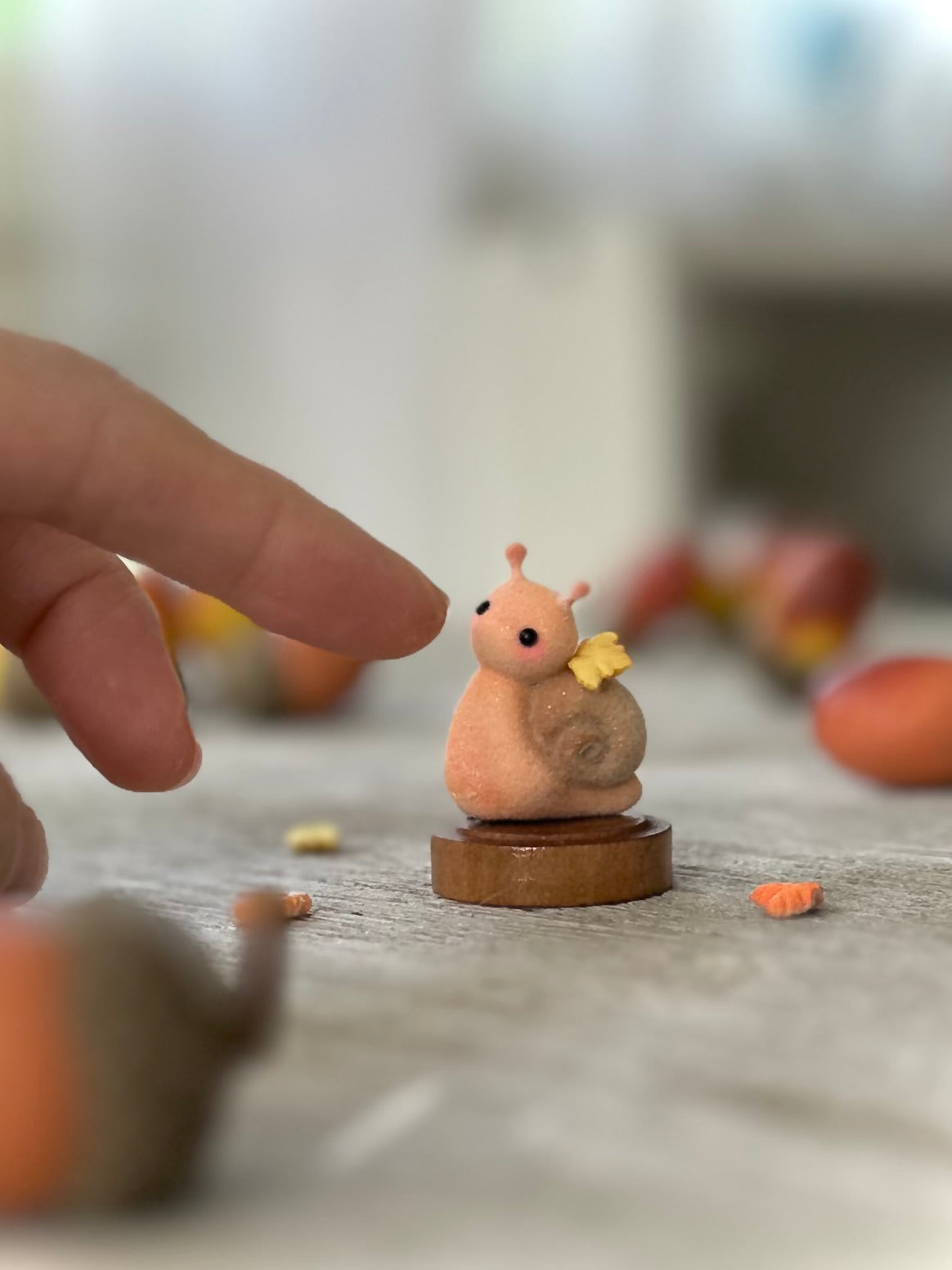 Fall snail 1.5 inch flocked, clay figurine with wooden base.