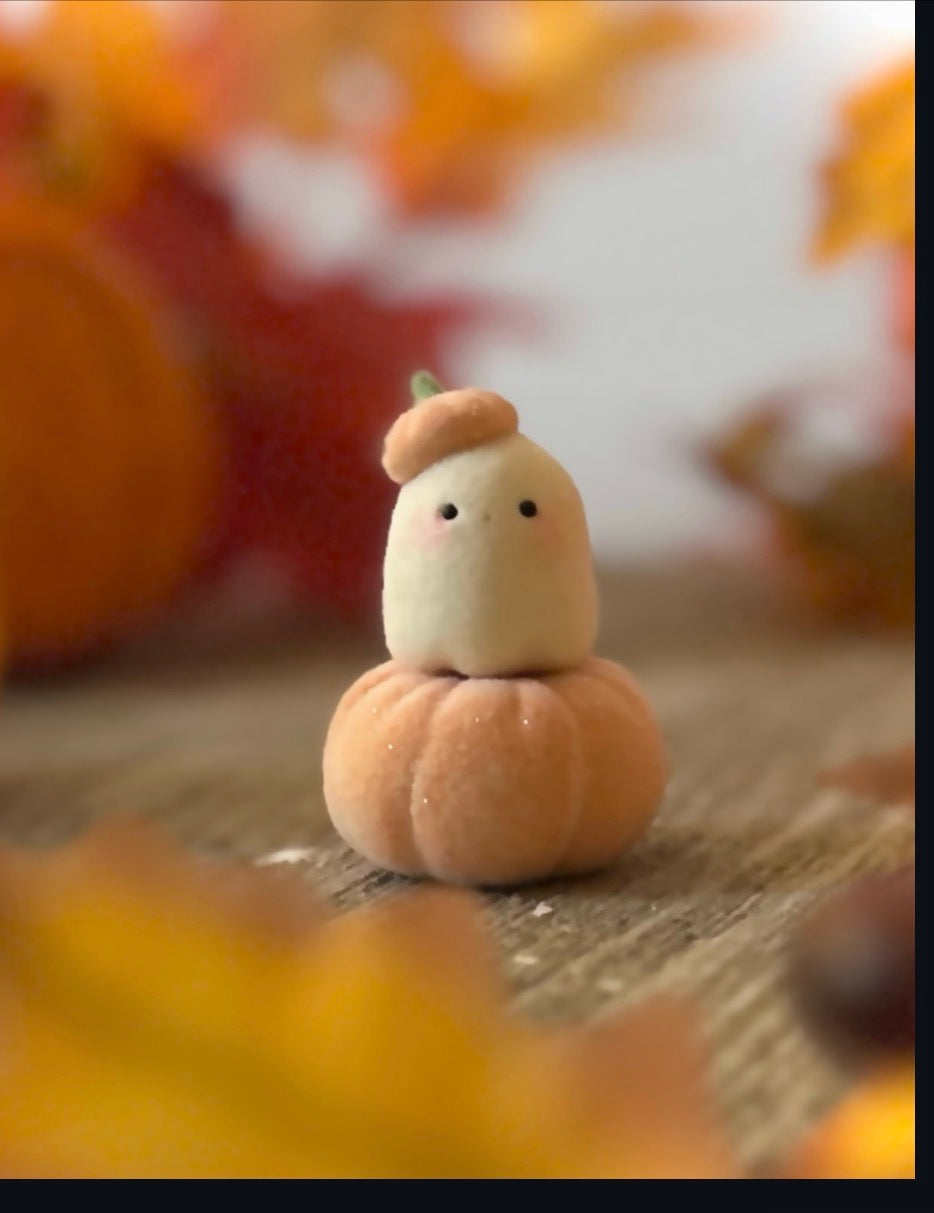 Bookin  2 inch flocked, clay figurine with wooden base.