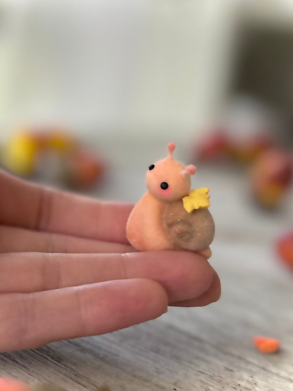 Fall snail 1.5 inch flocked, clay figurine with wooden base.