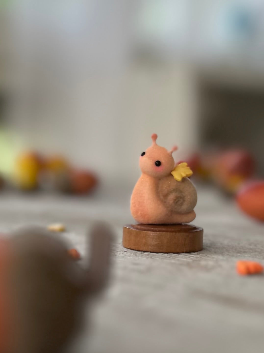 Fall snail 1.5 inch flocked, clay figurine with wooden base.