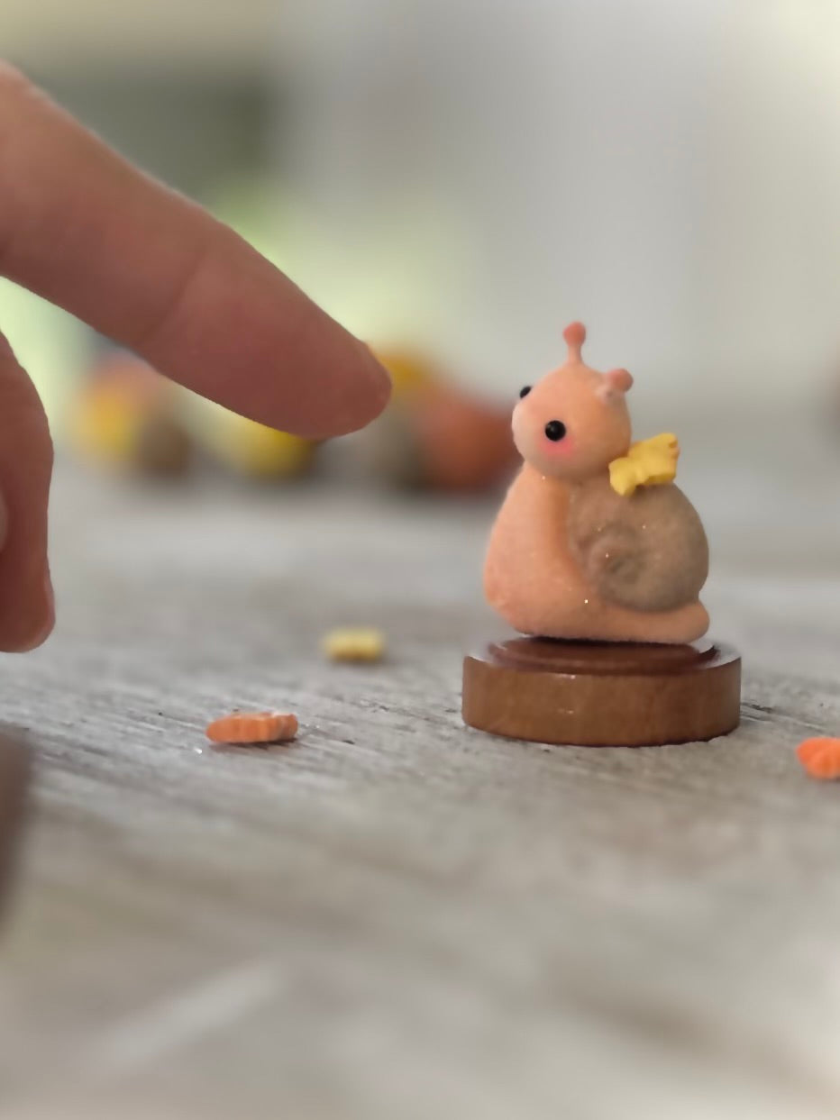 Fall snail 1.5 inch flocked, clay figurine with wooden base.