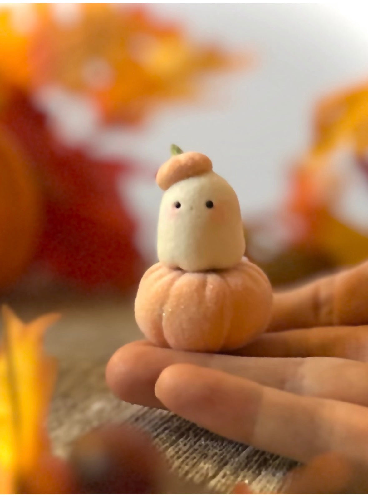 Bookin  2 inch flocked, clay figurine with wooden base.