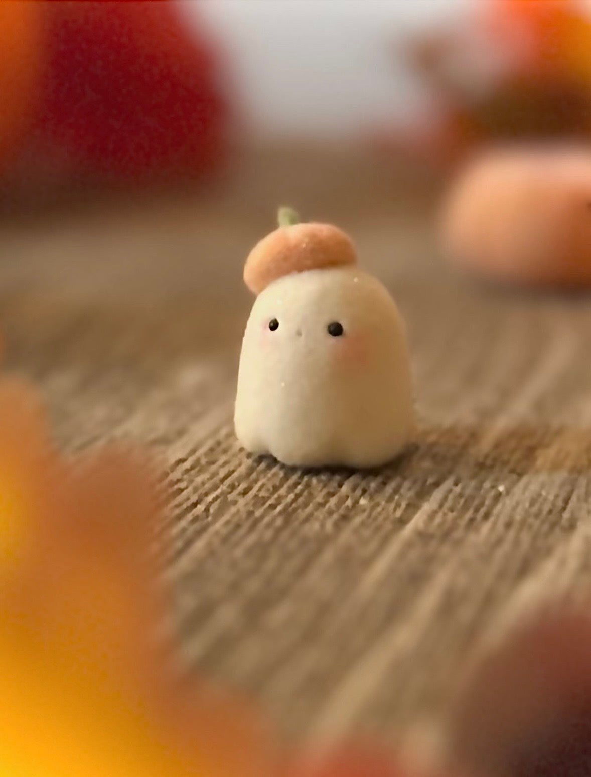 Bookin  2 inch flocked, clay figurine with wooden base.