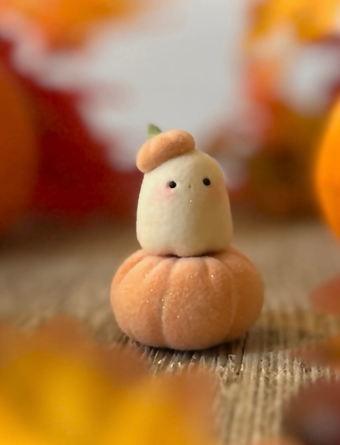Bookin  2 inch flocked, clay figurine with wooden base.