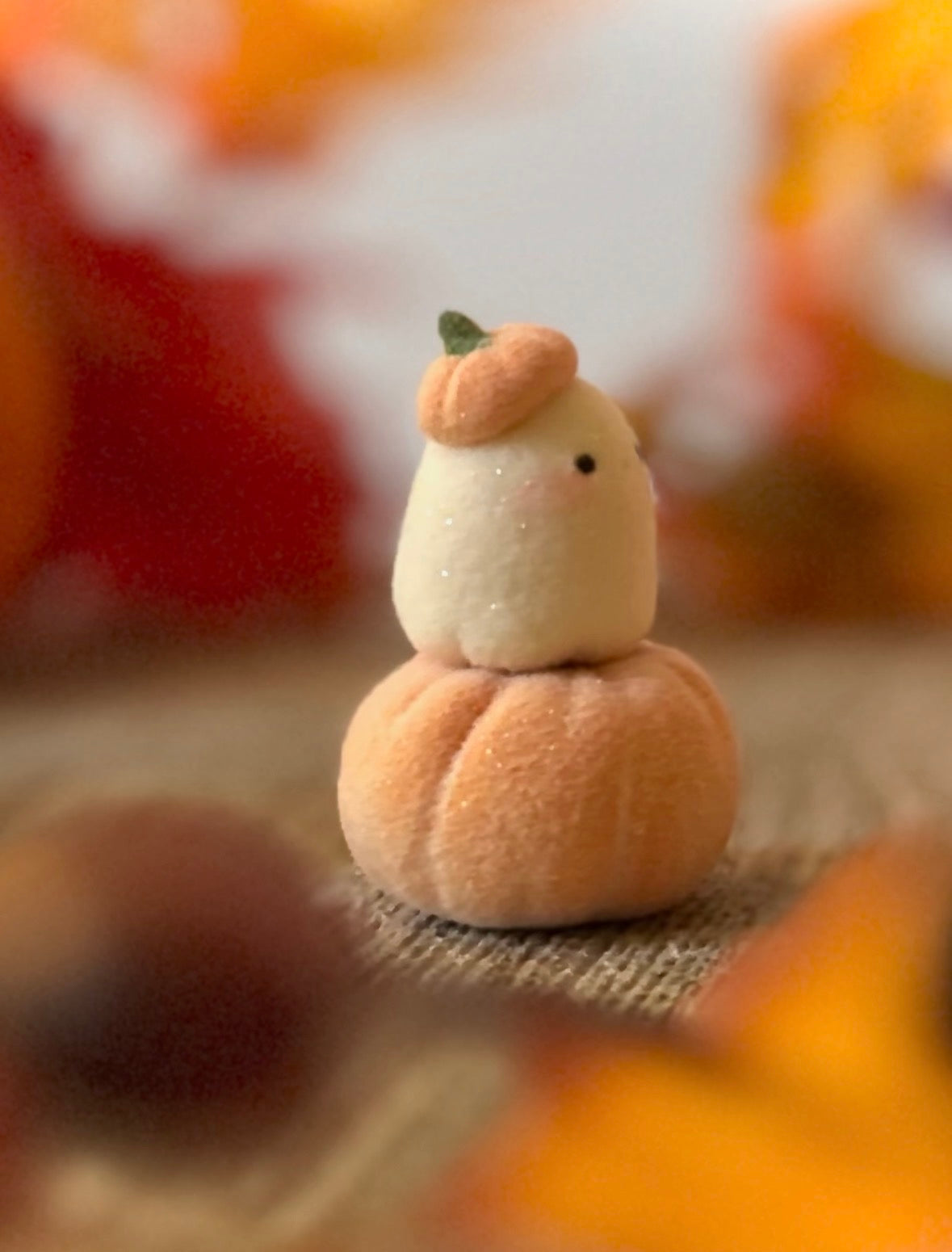 Bookin  2 inch flocked, clay figurine with wooden base.
