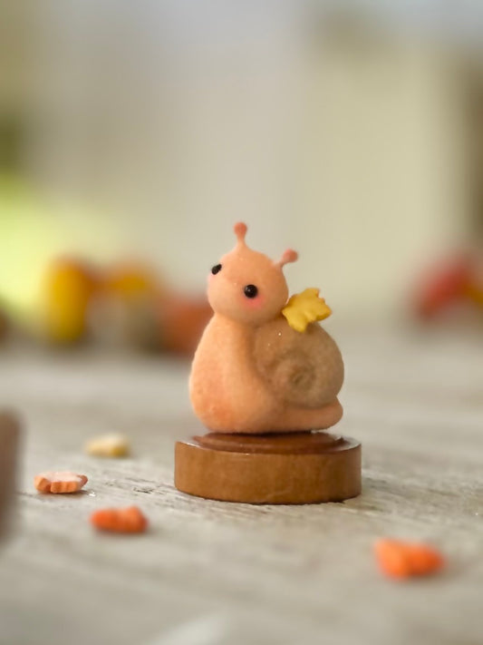 Fall snail 1.5 inch flocked, clay figurine with wooden base.