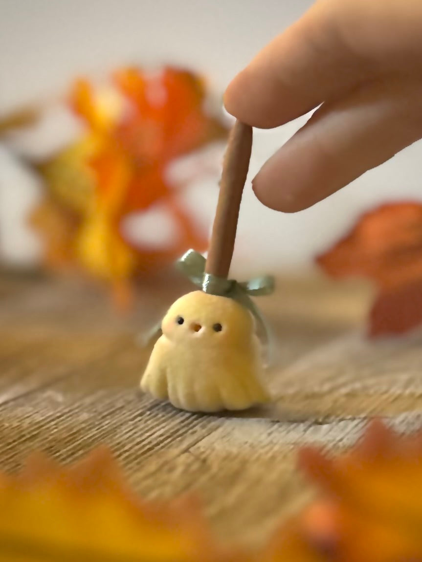 Broomhilda 2  inch flocked, clay figurine with wooden base.