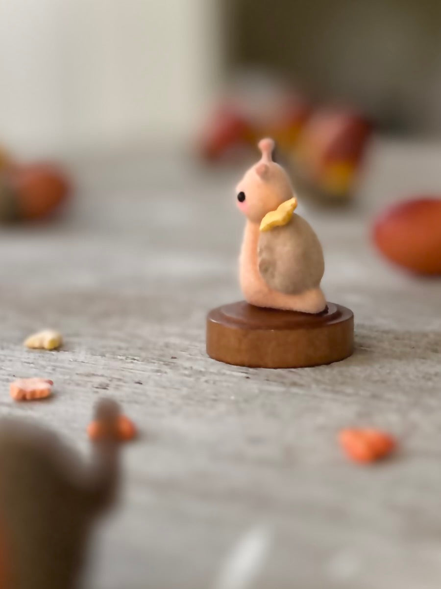 Fall snail 1.5 inch flocked, clay figurine with wooden base.