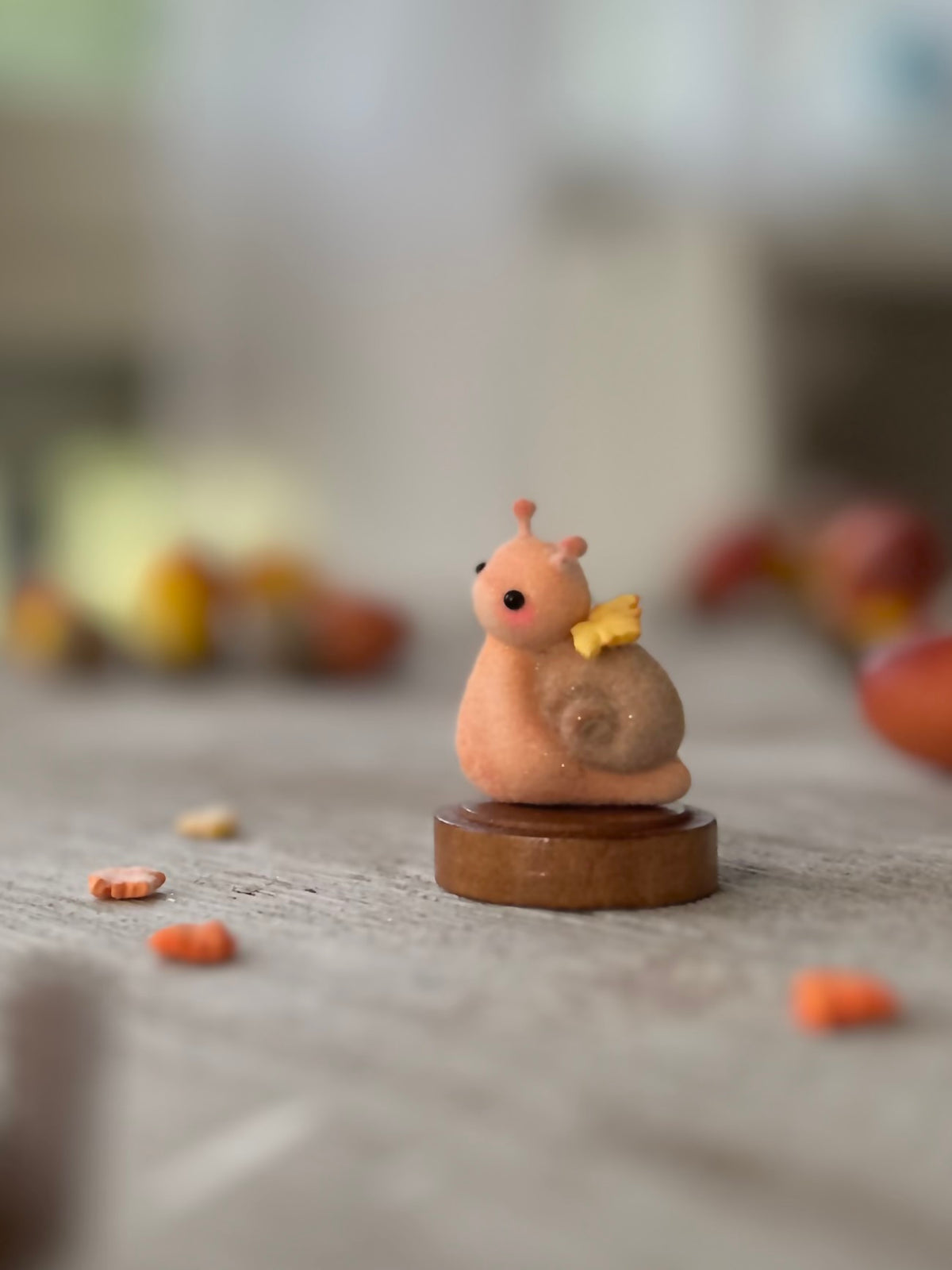 Fall snail 1.5 inch flocked, clay figurine with wooden base.