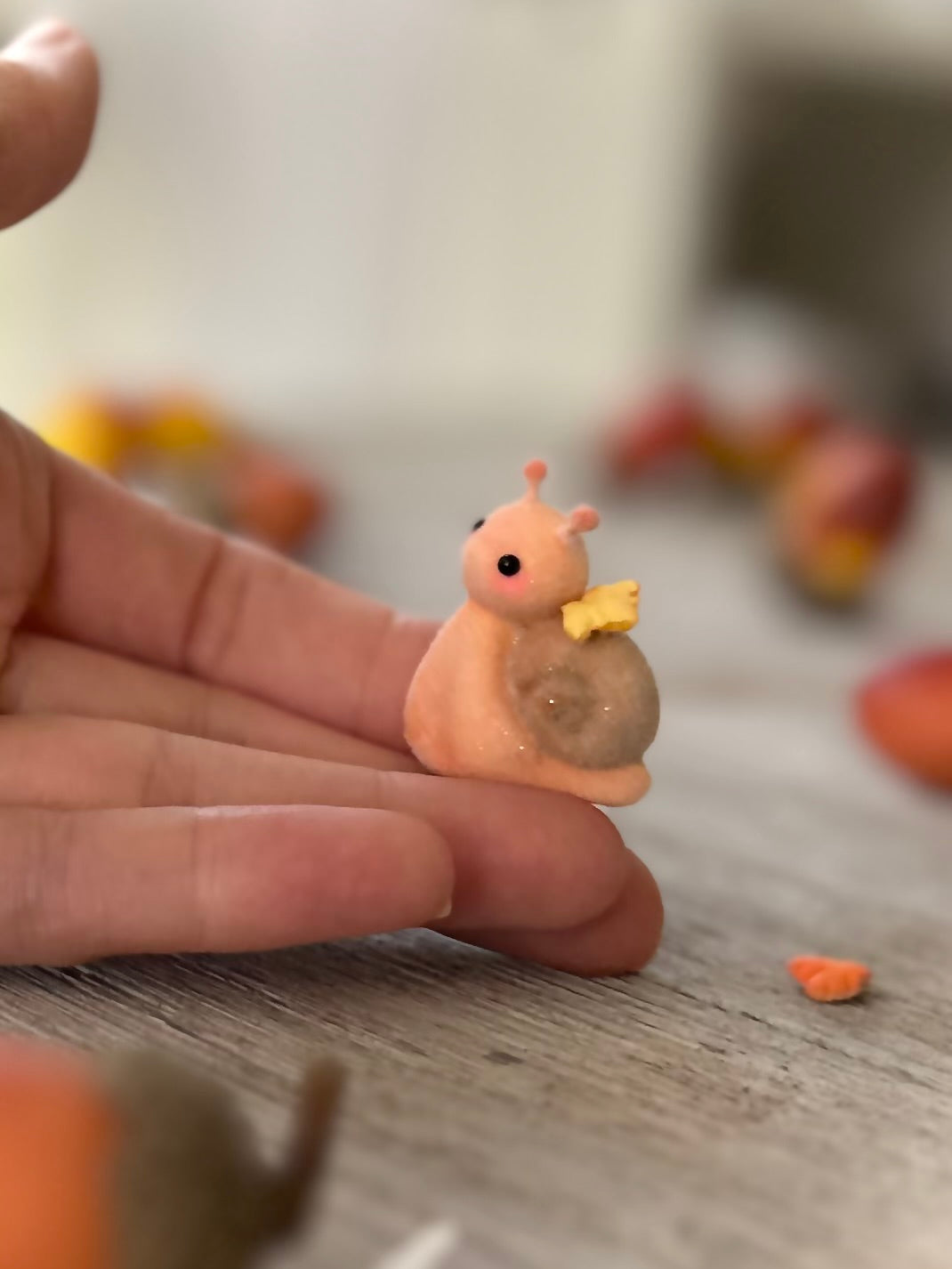 Fall snail 1.5 inch flocked, clay figurine with wooden base.