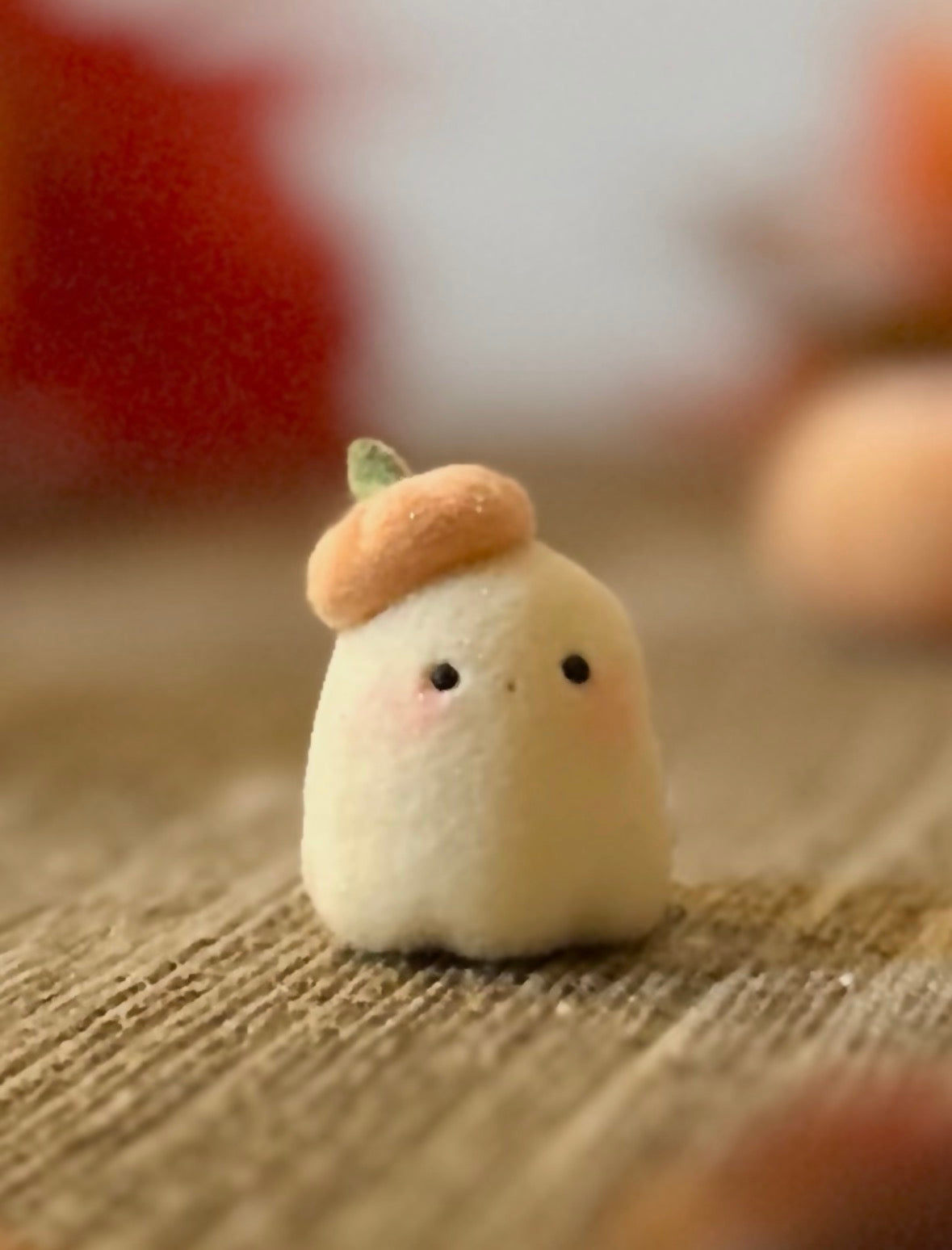 Bookin  2 inch flocked, clay figurine with wooden base.