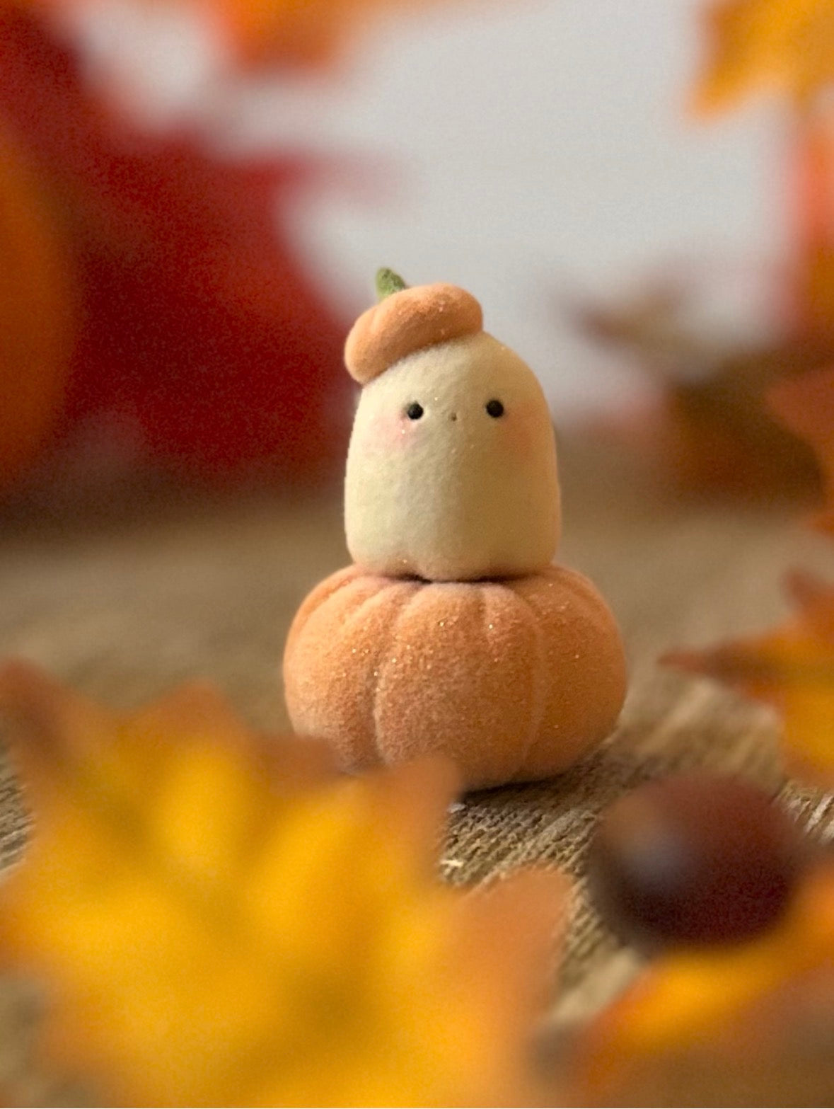 Bookin  2 inch flocked, clay figurine with wooden base.