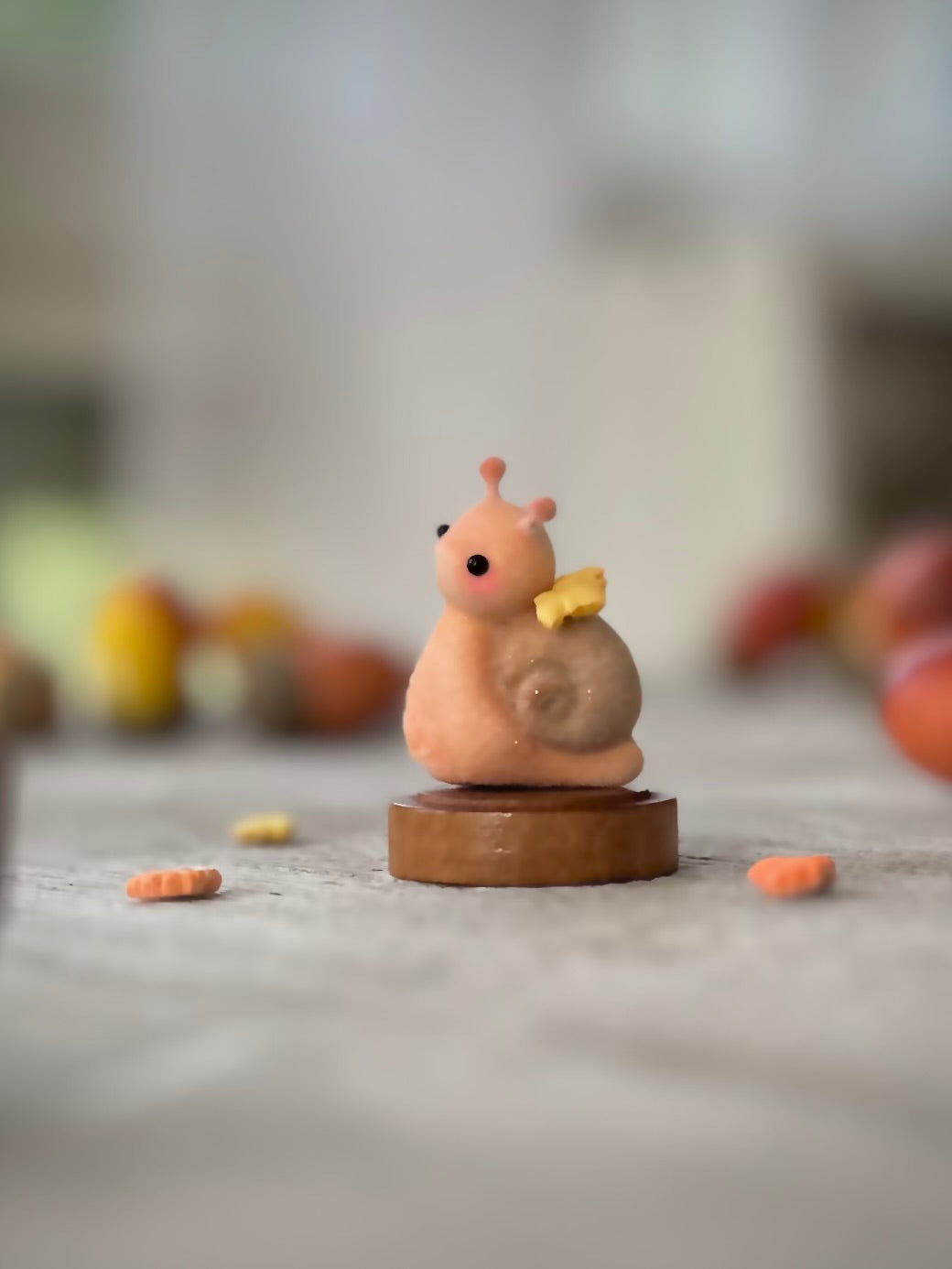 Fall snail 1.5 inch flocked, clay figurine with wooden base.