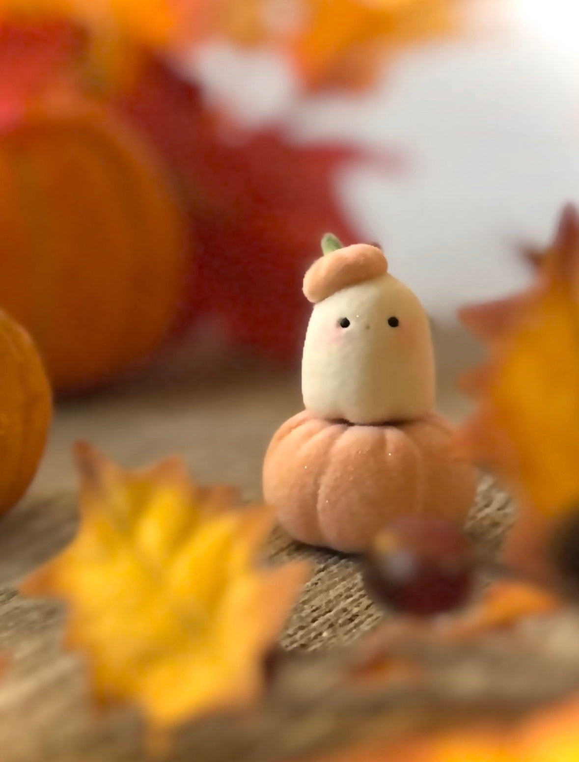 Bookin  2 inch flocked, clay figurine with wooden base.