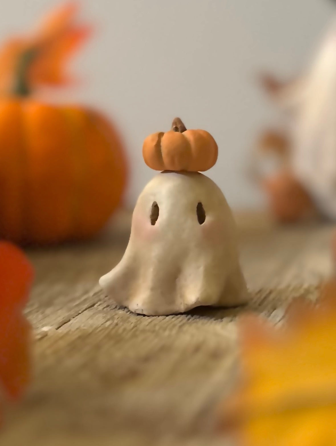 Punkin head Boo 2 inch clay figurine with wooden base.