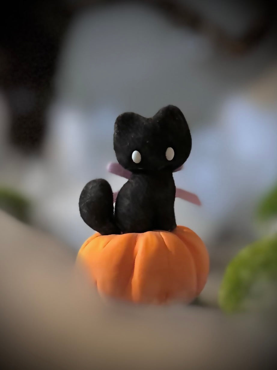Charlie Black Cat with Pumkin base.  2.25 inch clay figurine. Pumpkin not flocked