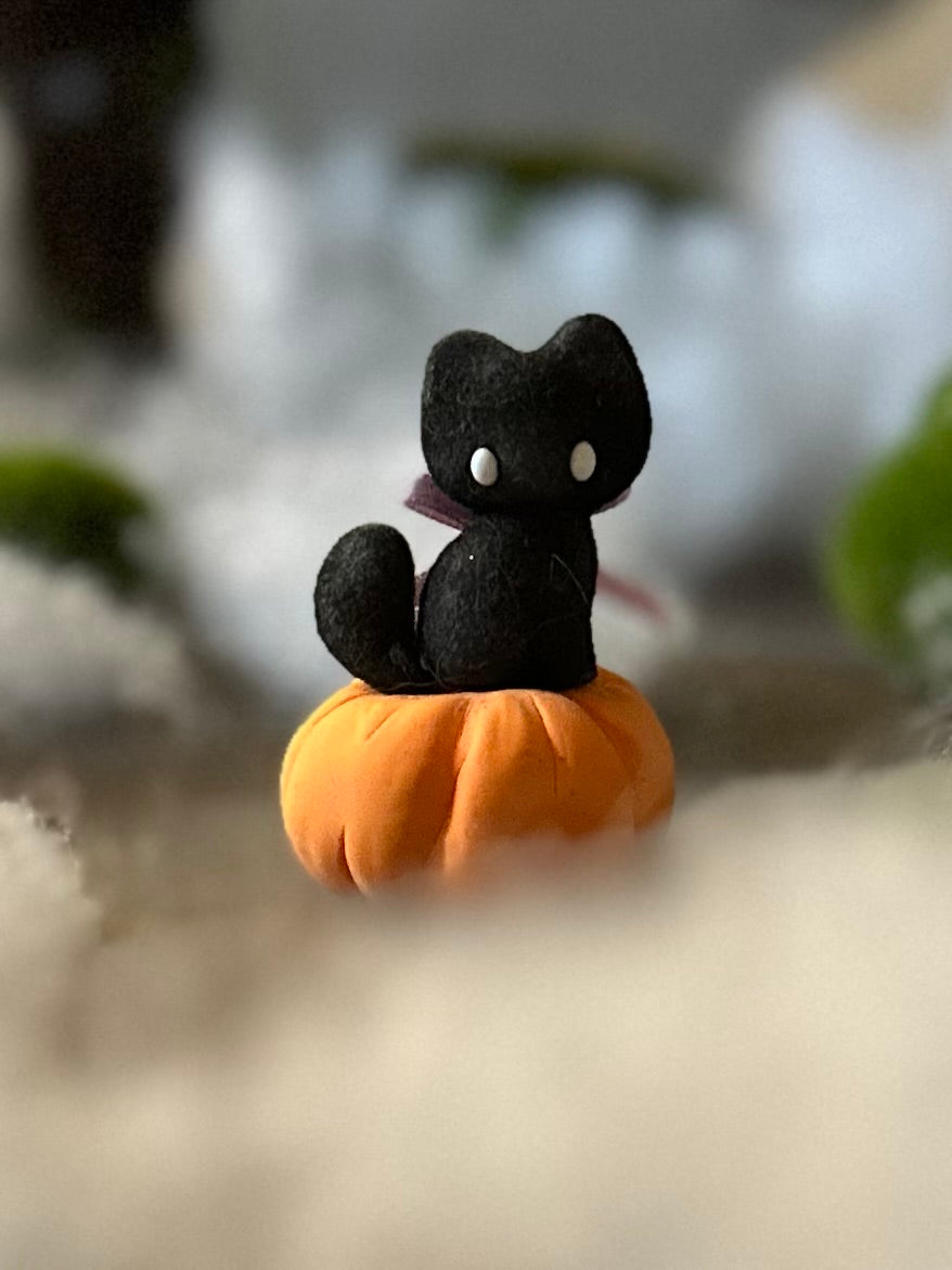 Charlie Black Cat with Pumkin base.  2.25 inch clay figurine. Pumpkin not flocked